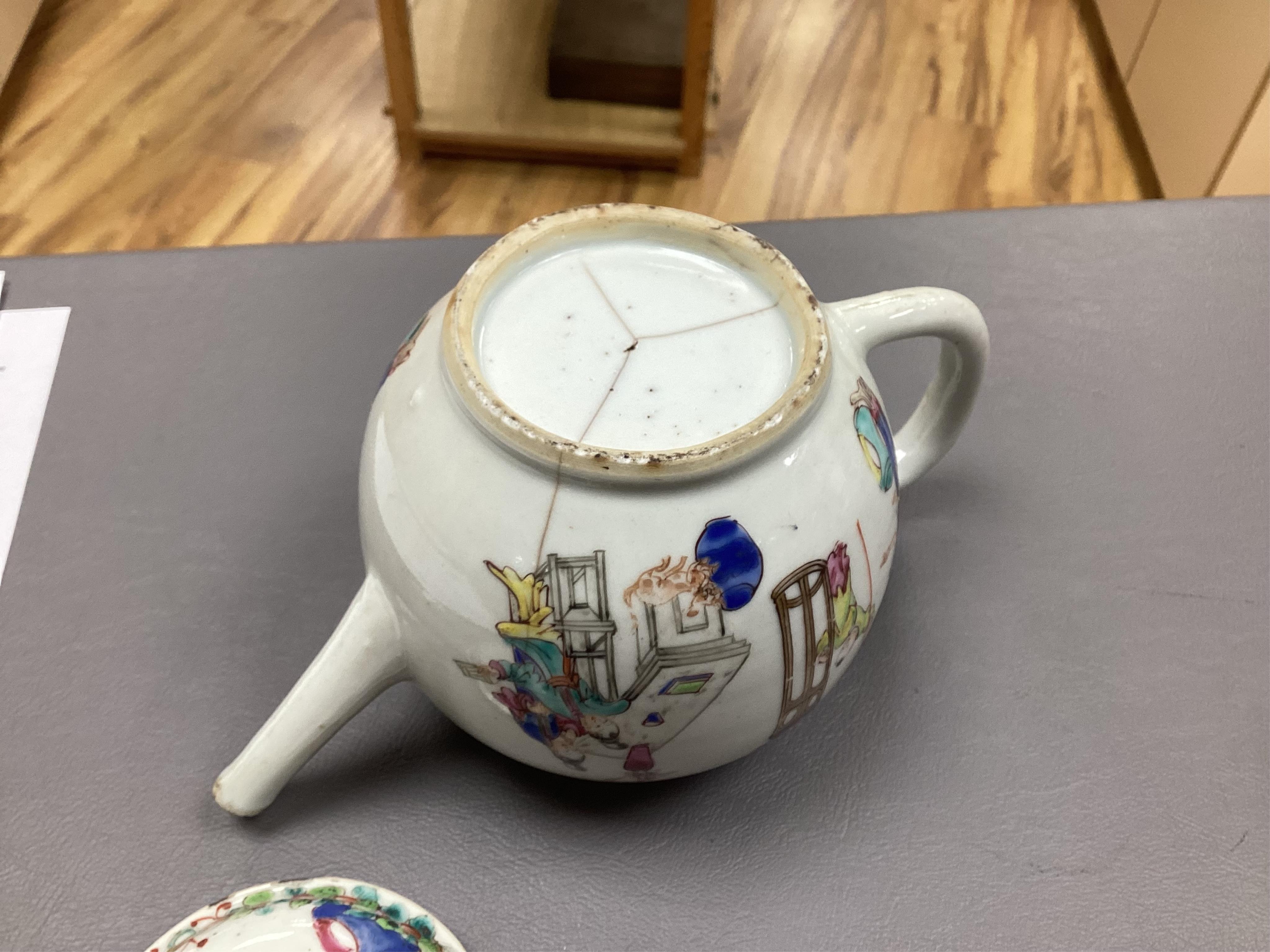 A Chinese famille rose ‘boys and ladies’ teapot, Qianlong period and a Japanese Arita sake pot or ewer, early 18th century, tallest 16cm high.